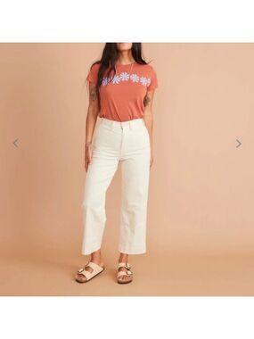 Orange Daisy Print T-Shirt and White Pants